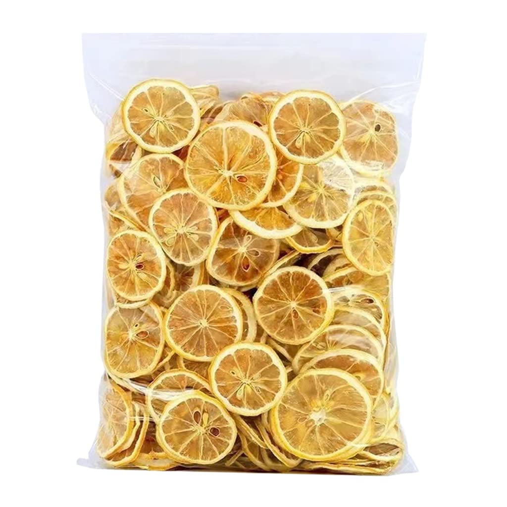 Mkostlich dried lemon slices in a bowl with tea and baking ingredients